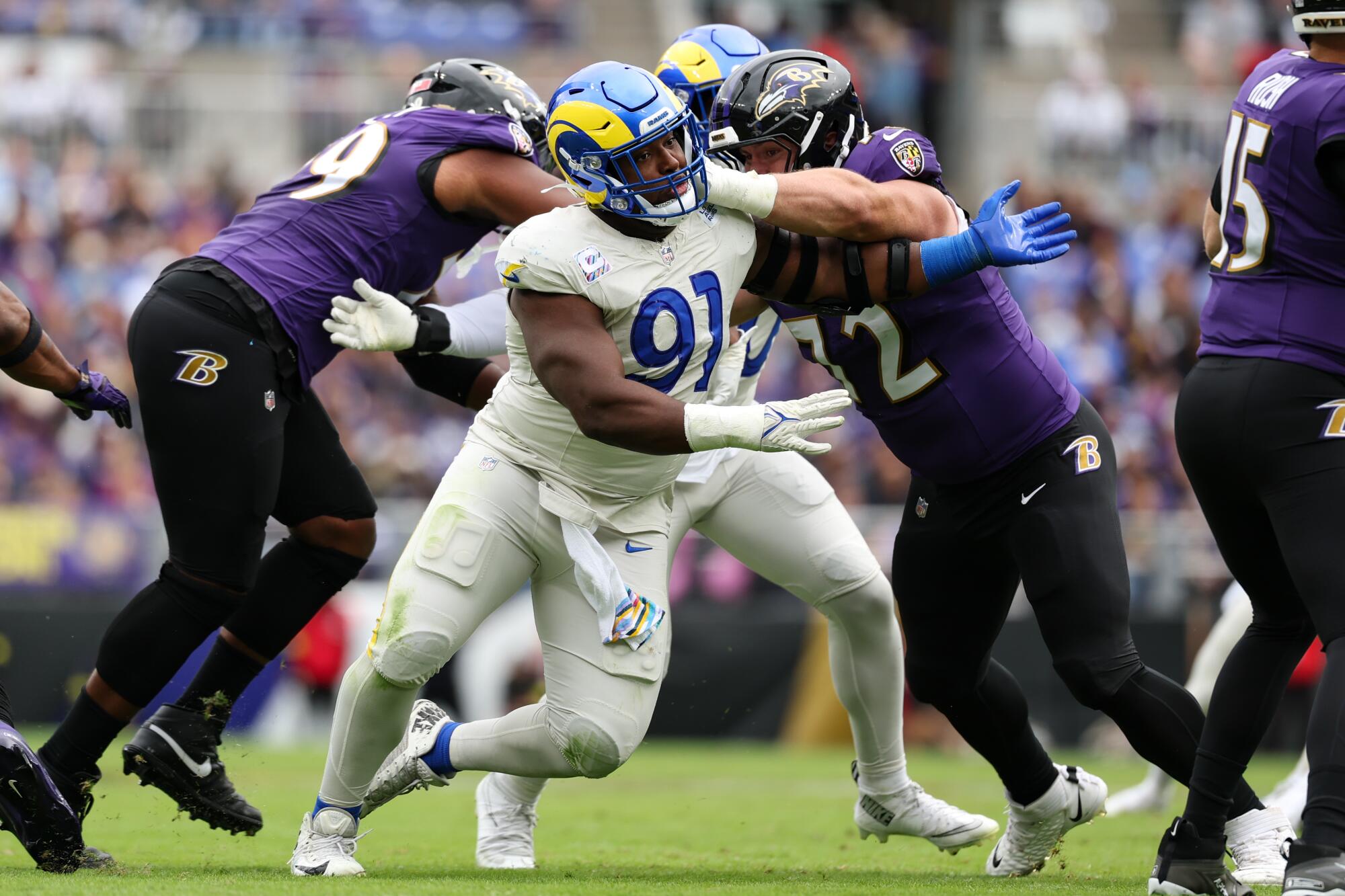 Rams defensive end Kobie Turner tries to break through the Baltimore Ravens' offensive line.