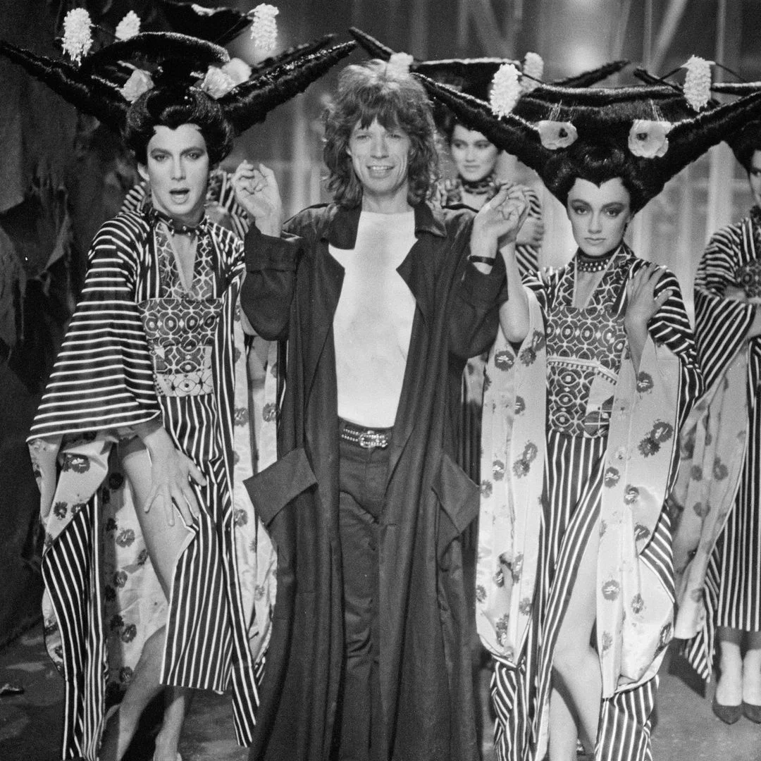 Italian choreographer Bruno Tonioli (left) with Mick Jagger  on the set of the Rolling Stones' music video for 'One Hit (To the Body)', England, 6th May 1986