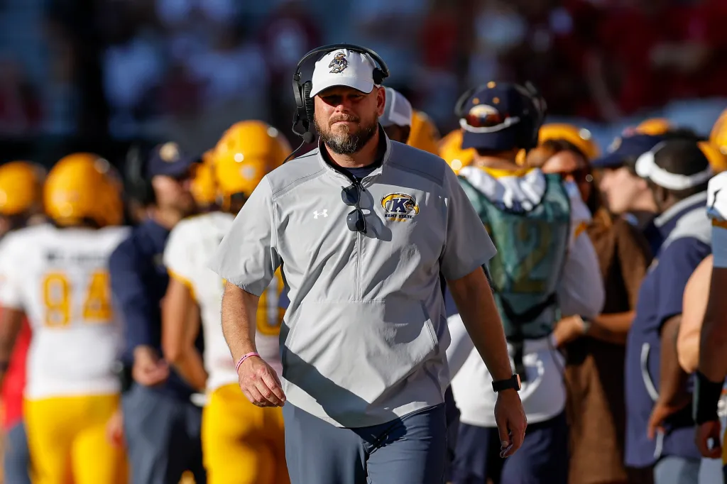 Kent State head coach Mark Carney walks down the sideline.