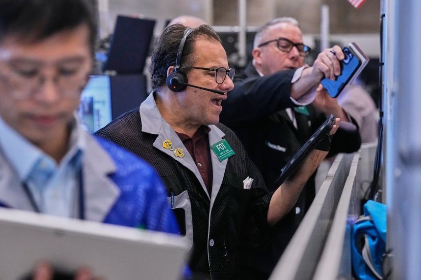 Traders work on the floor of the New York Stock Exchange on November 18. (AP Photo/Richard Drew)