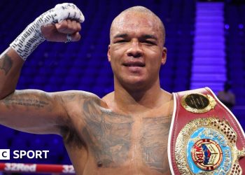 Fabio Wardley celebrates victory with his belt after his fight with Joseph Parker