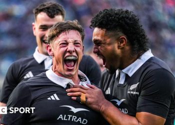 Cam Roigard celebrates