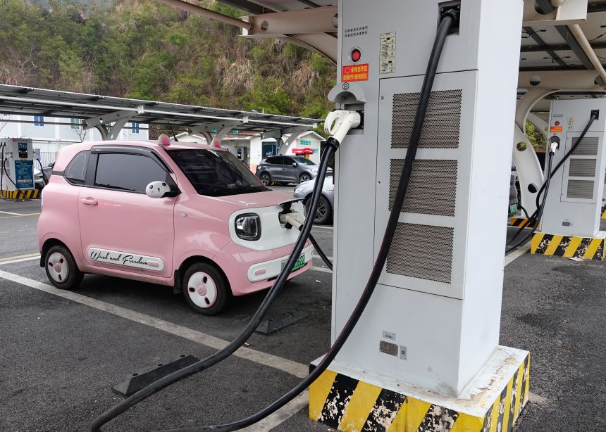An electric vehicle charges at a charging station in Yichang, Hubei, China, on January 21, 2026.