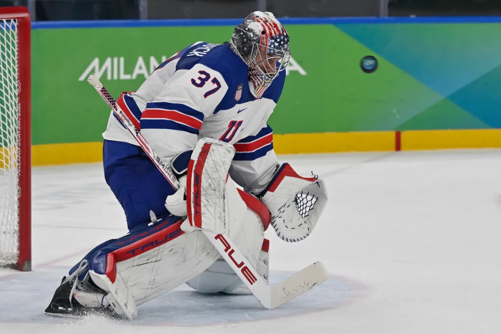 Connor Hellebuyck saves the puck during the men's play-off semi-final ice hockey match between USA and Slovakia at the Milano Santagiulia Ice Hockey Arena during the Milano Cortina 2026 Winter Olympic Games in Milan, on February 20, 2026. 