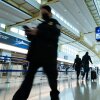 Travelers and staff walk through Ronald Reagan Washington National Airport in Arlington, Va., on Friday. U.S. Transportation Security Administration security officers missed their first full paycheck Friday as a partial funding shutdown of the government approached the one-month mark.