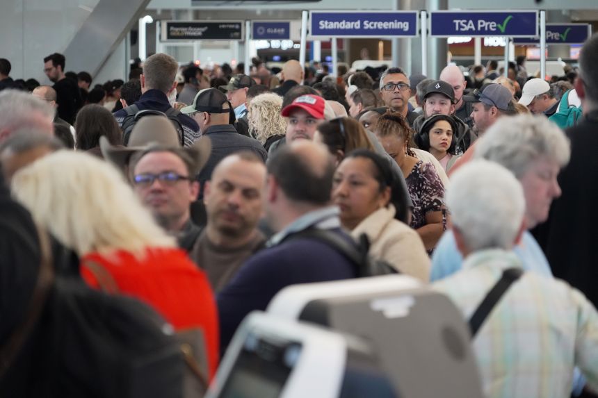 Airline passengers wait in long lines to get through the TSA security screening at George Bush Intercontinental Airport in Houston on Wednesday.