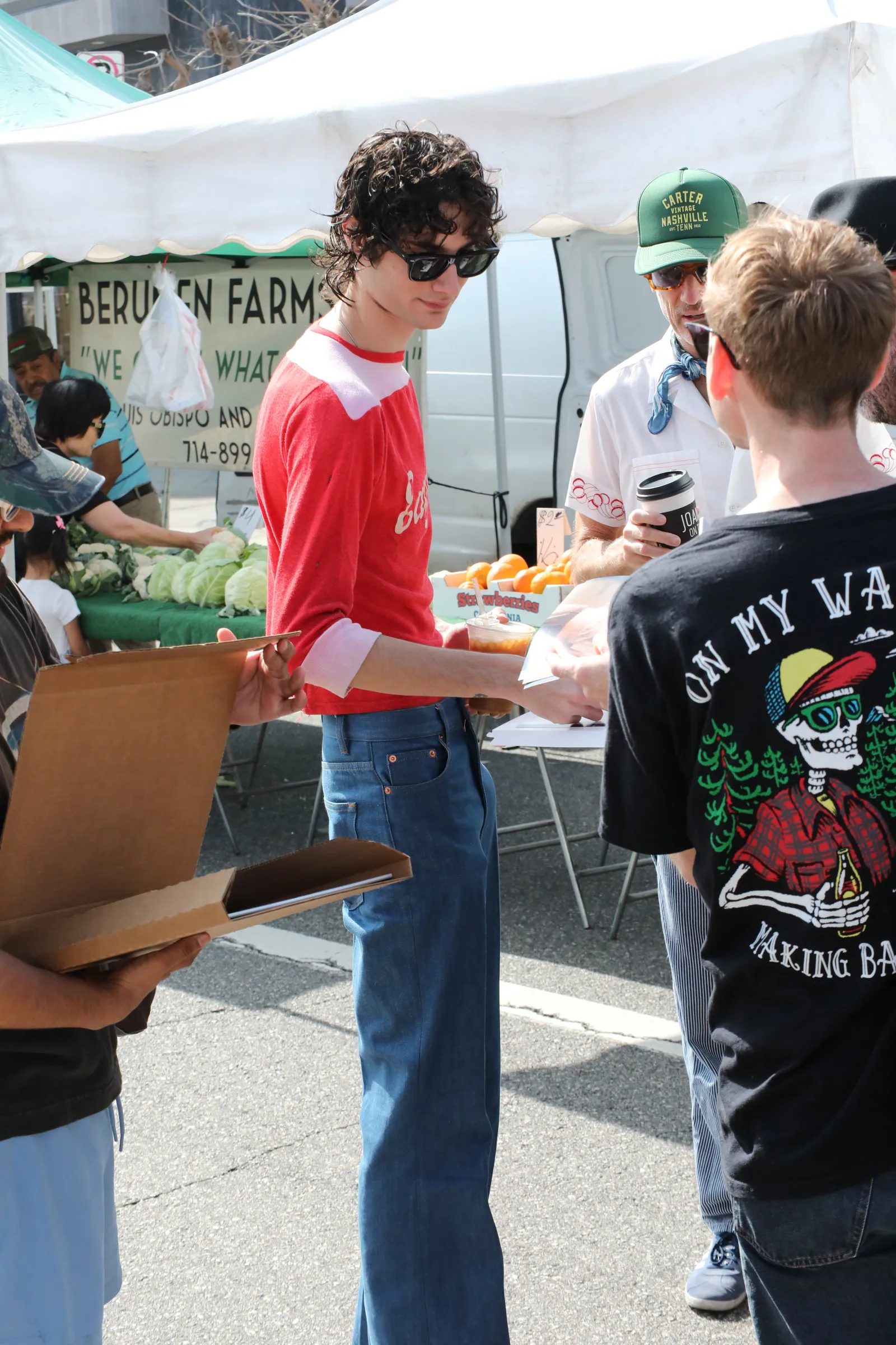 Image may contain Simon Amstell Alejandro Patino Clothing Pants Person Teen Adult Market Baseball Cap Cap and Hat