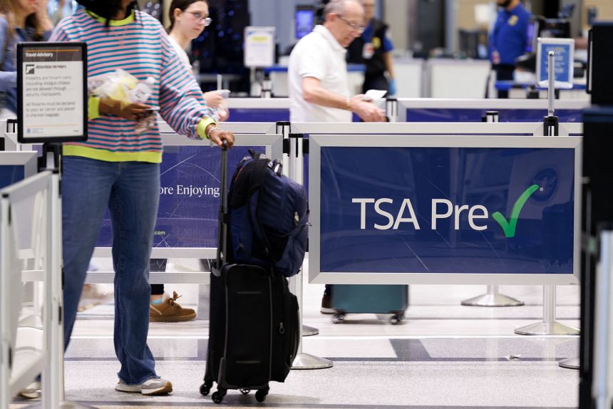People wait in a TSA security line at William P. Hobby Airport in Houston last week.