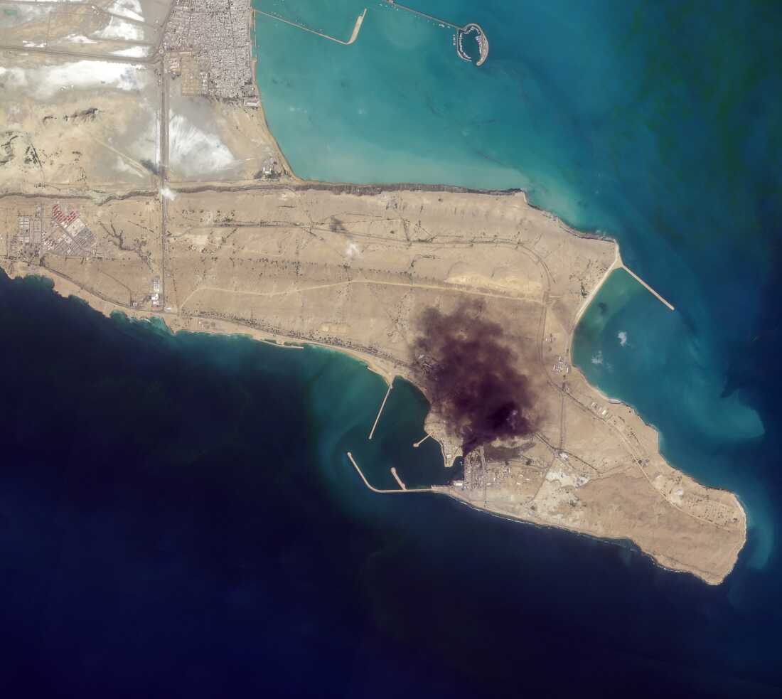 Smoke rises over Konarak naval base in southern Iran on Sunday. The base was one of hundreds of targets of U.S. and Israeli forces throughout the country.