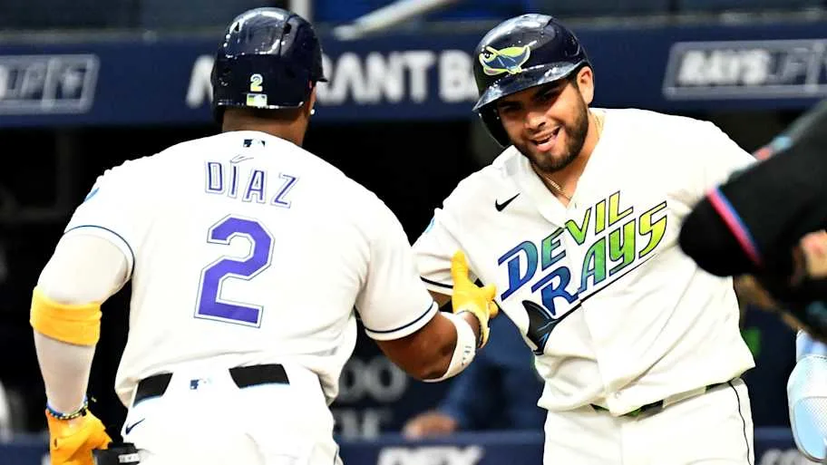 Tampa Bay Rays designated hitter Yandy Diaz celebrates with first baseman Jonathan Aranda after hitting a two run home run.